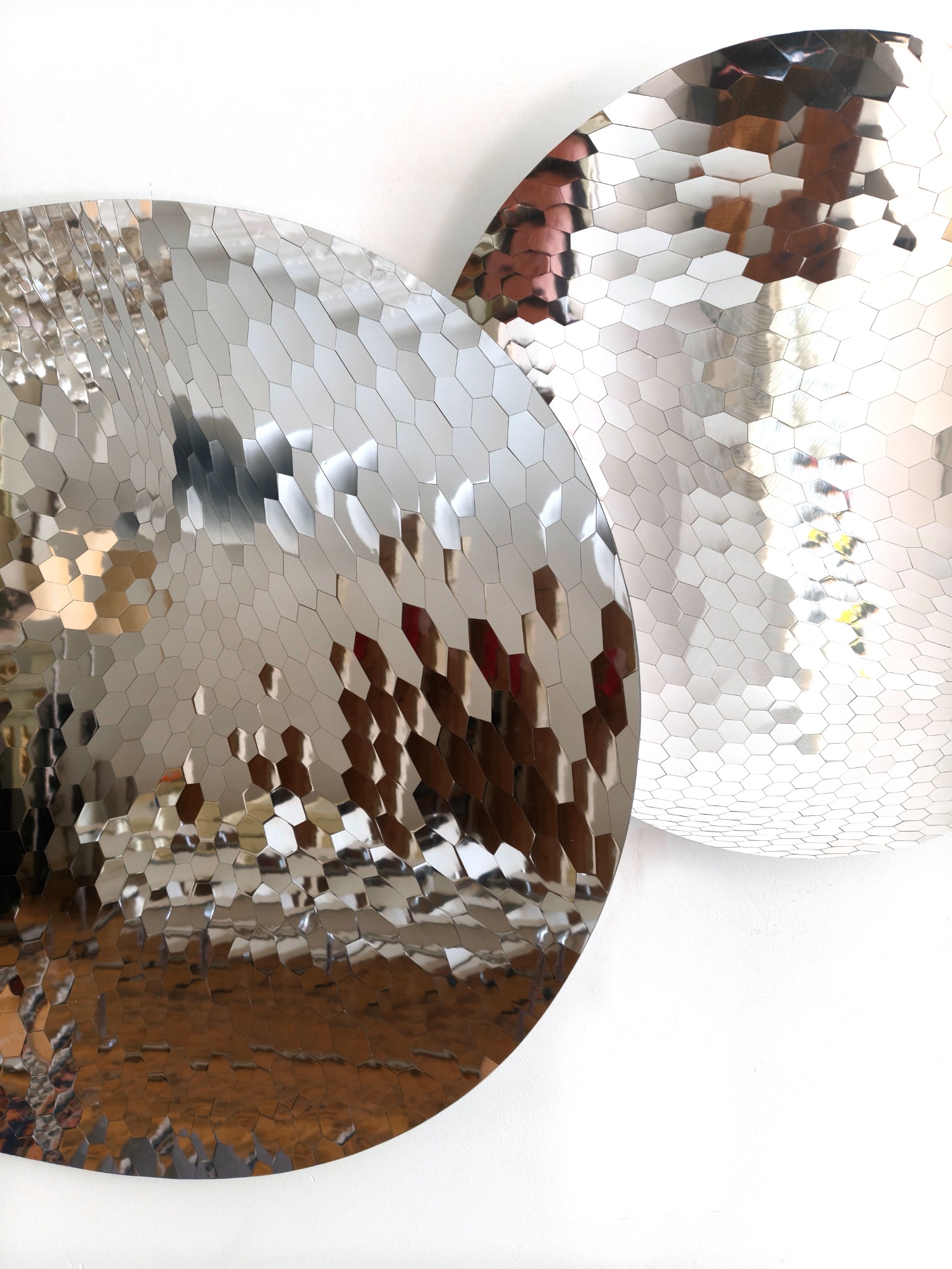 Two mirrors producing changing reflections
