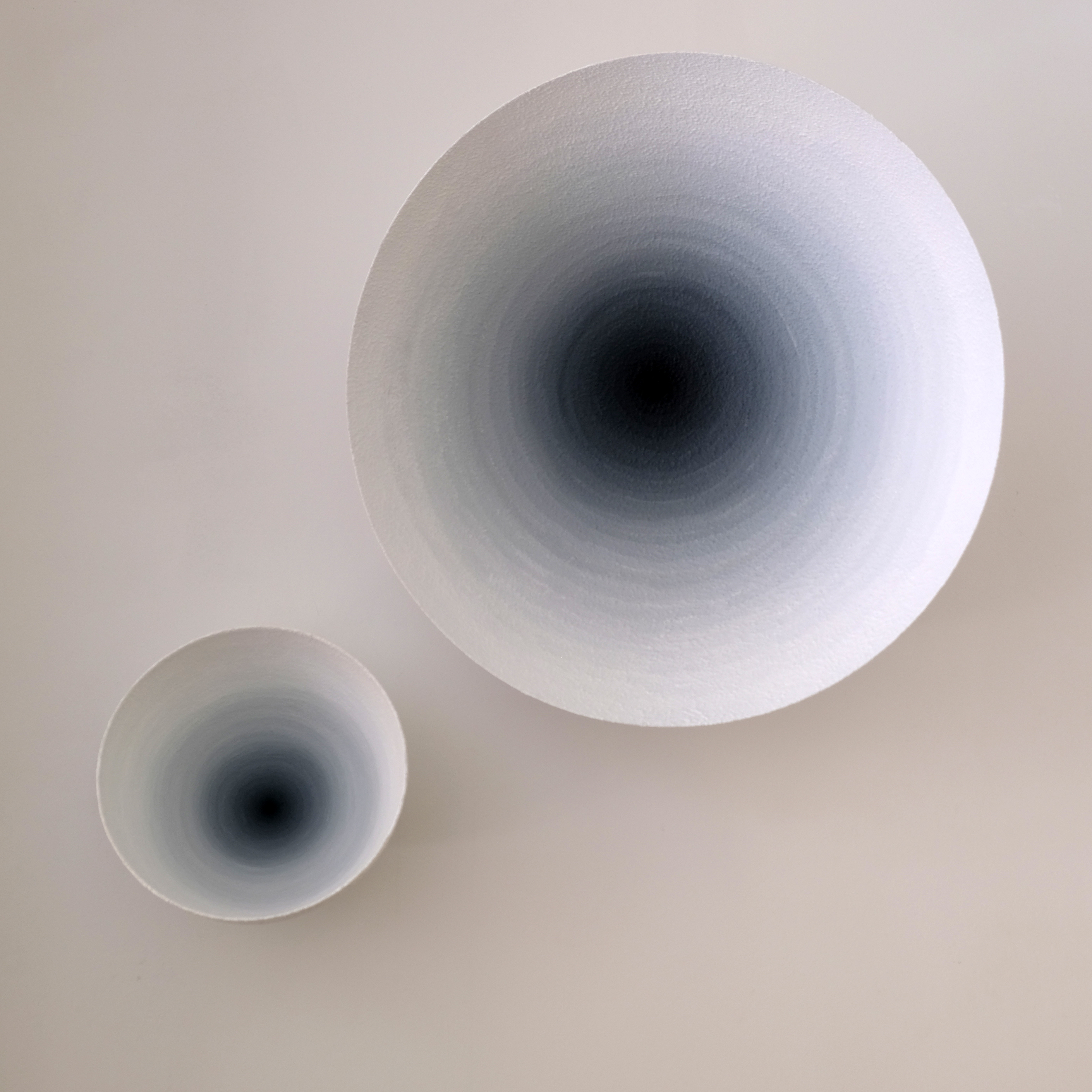 Two white shell-like concentric works