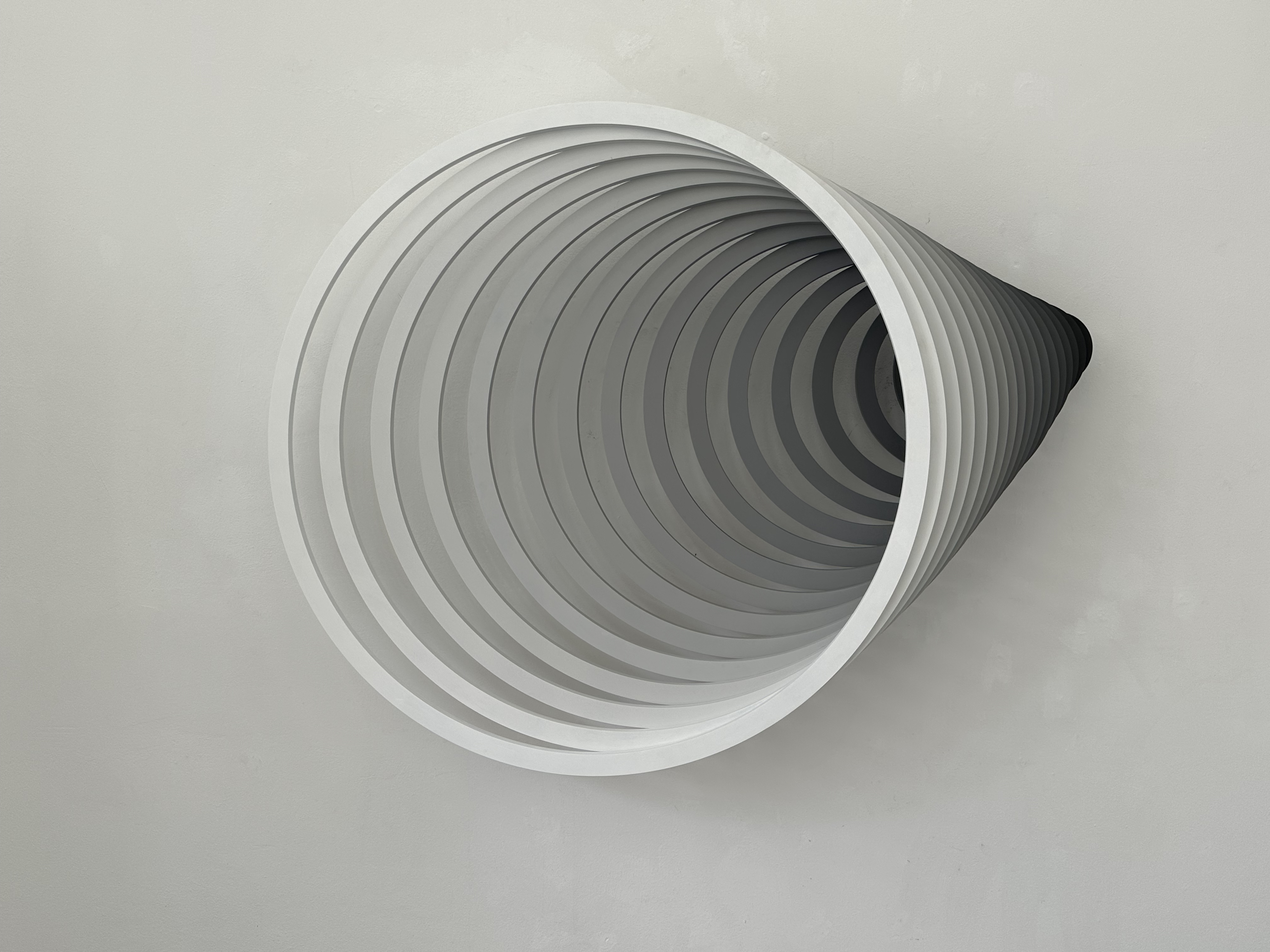 Sculptural horn form with a tonal gradient