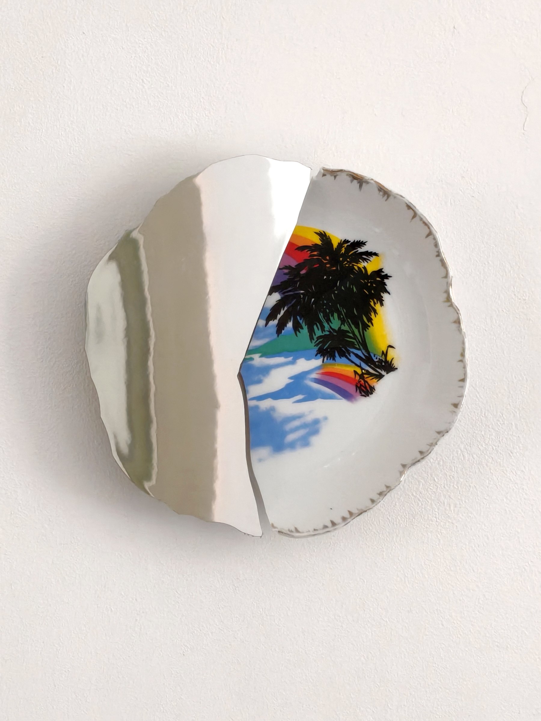 Round porcelain mirror plate with a painted palm scene